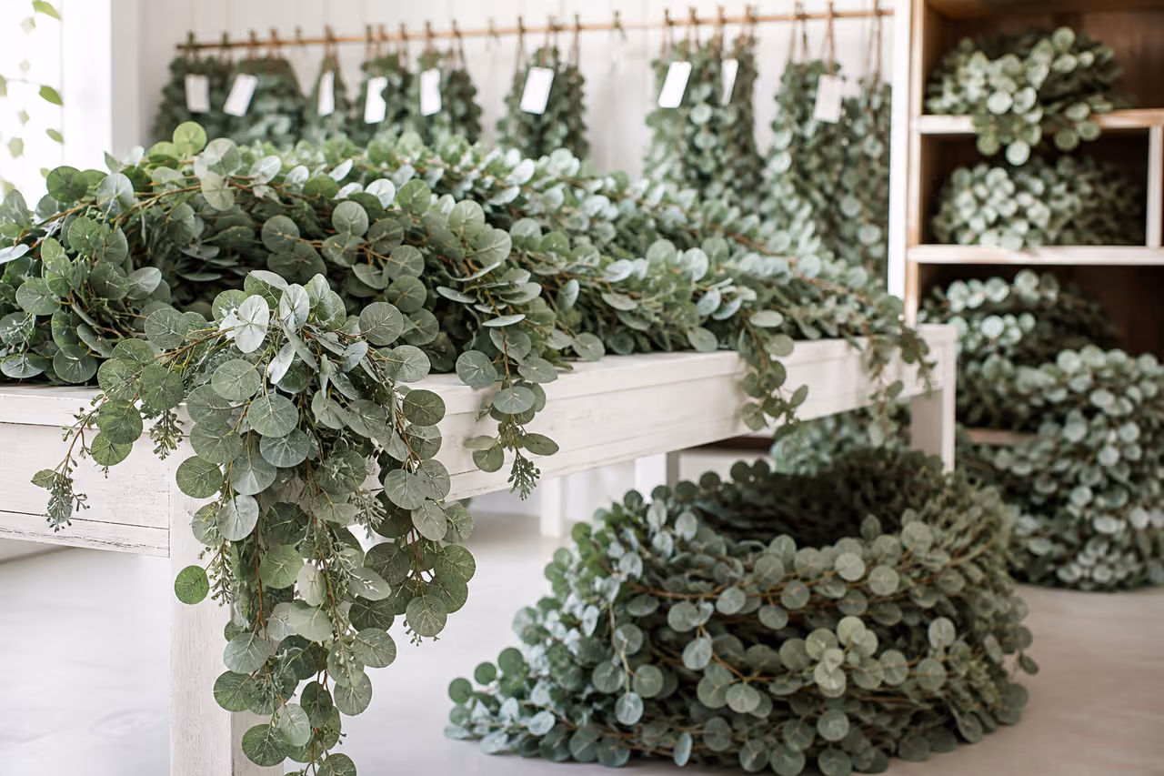 Bulk Fake Eucalyptus Garlands Arranged in a Bright Studio