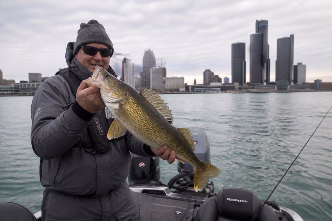 Fisherman Holding Large Walleye on the Detroit River