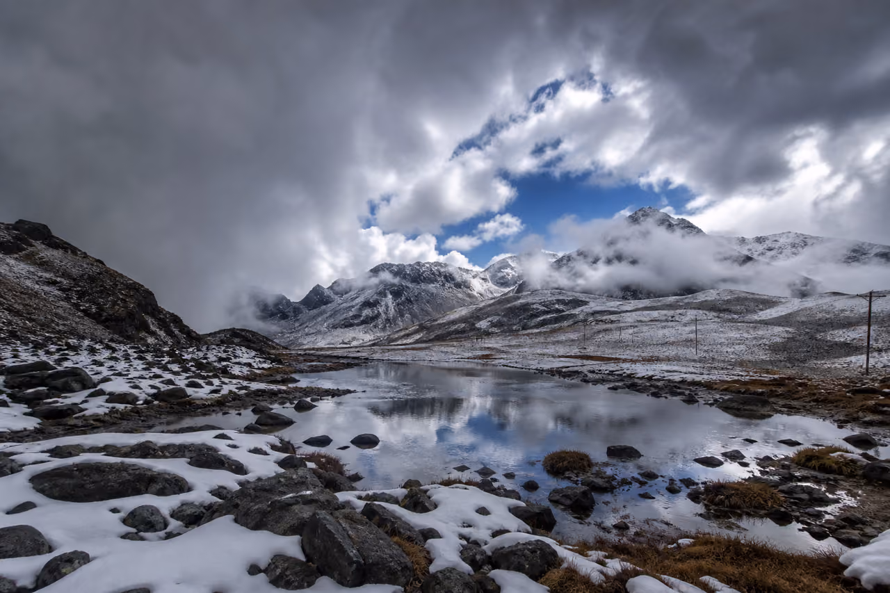 Dramatic Storm Clouds and Snow at Sela Pass