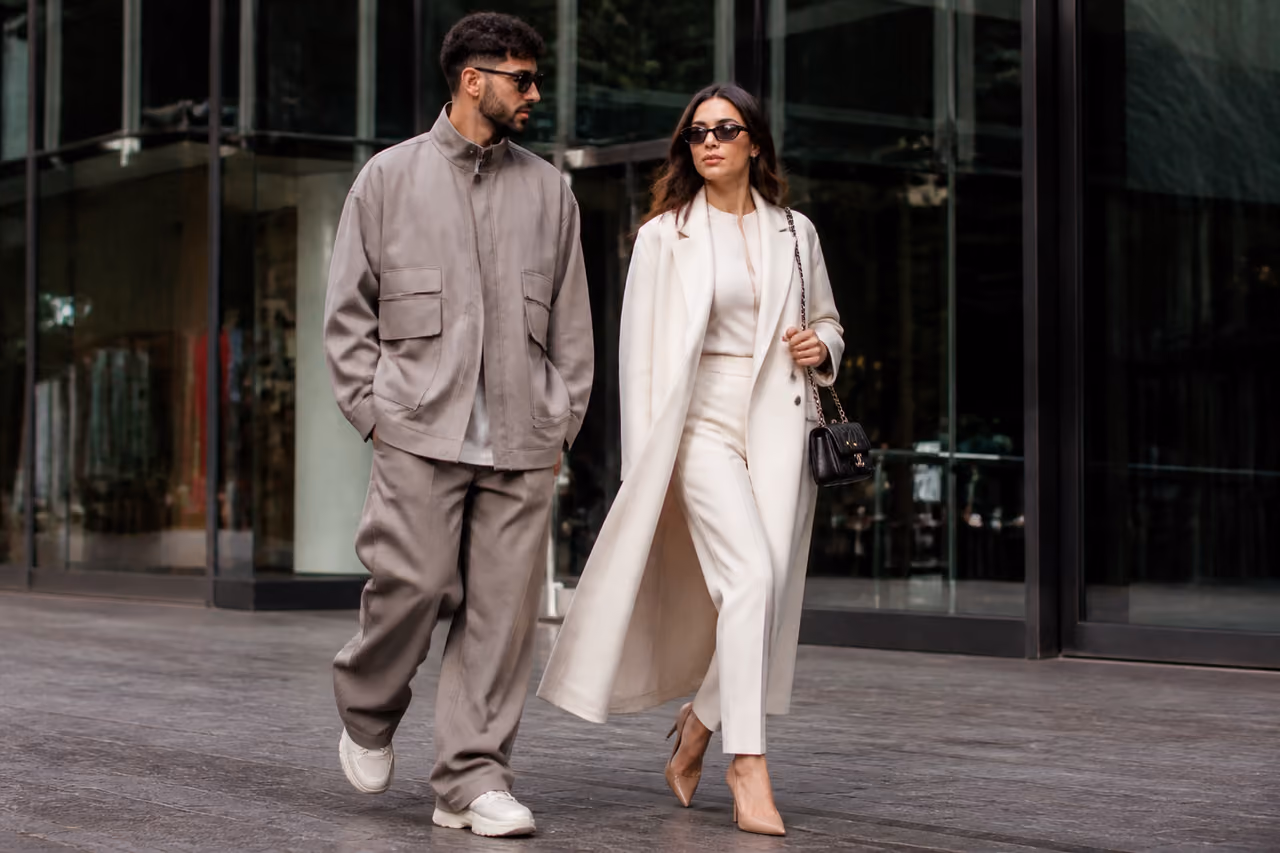 Fashionable Man and Woman Walking in Urban City Center