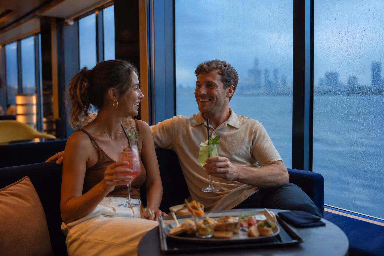 Couple Relaxing in Cruise Ship Lounge During Rain
