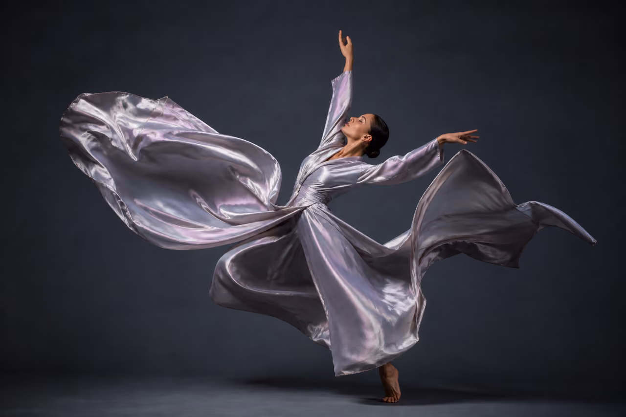 Contemporary Dancer Performing with Flowing Silk Fabric