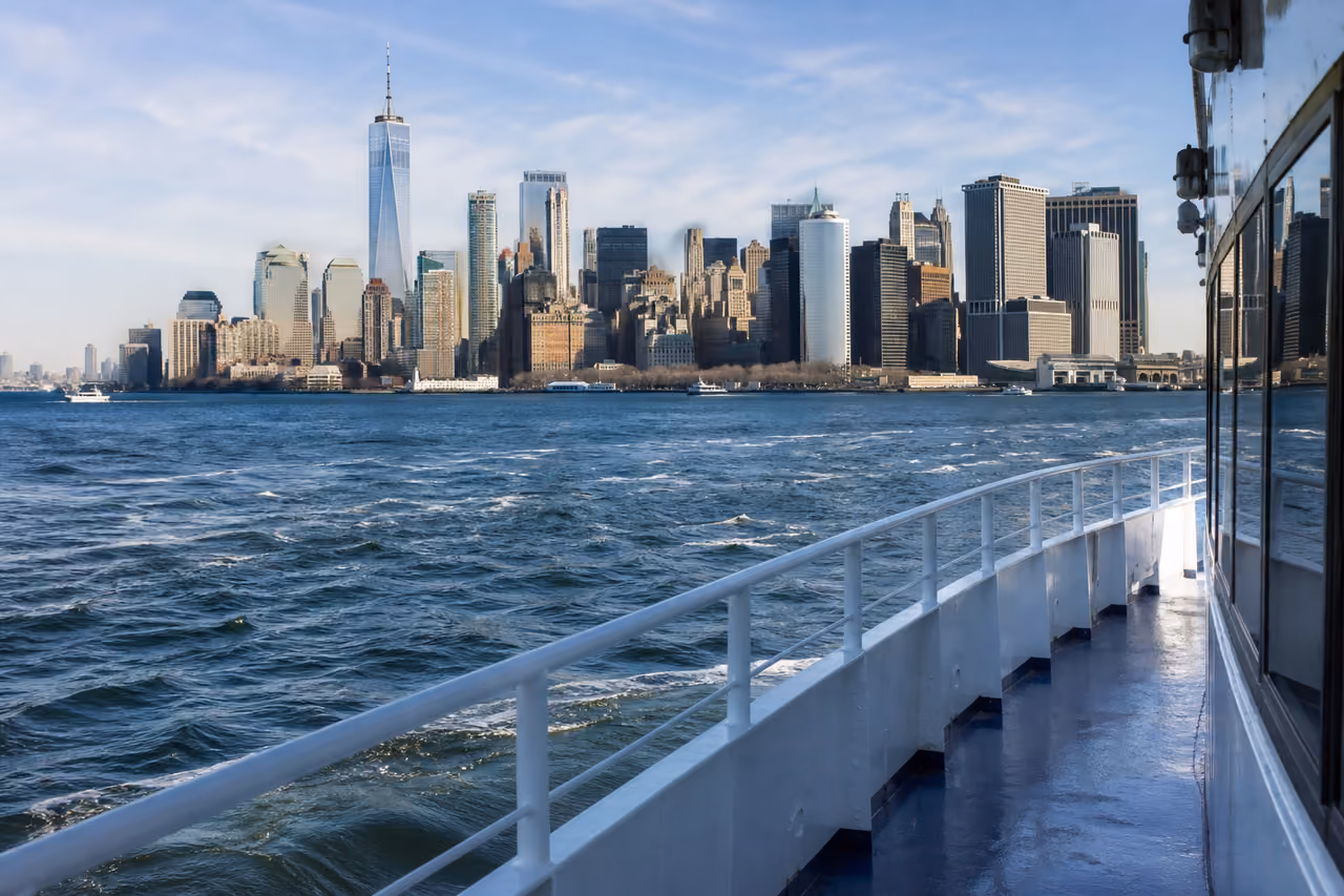 Passenger Ferry Traveling Toward Governors Island with Manhattan Skyline