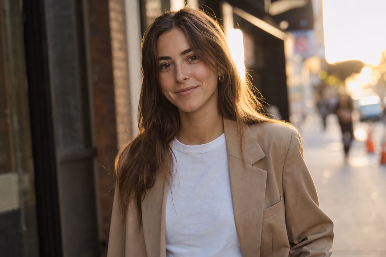 Stylish Young Woman Posing on a Sunny City Sidewalk