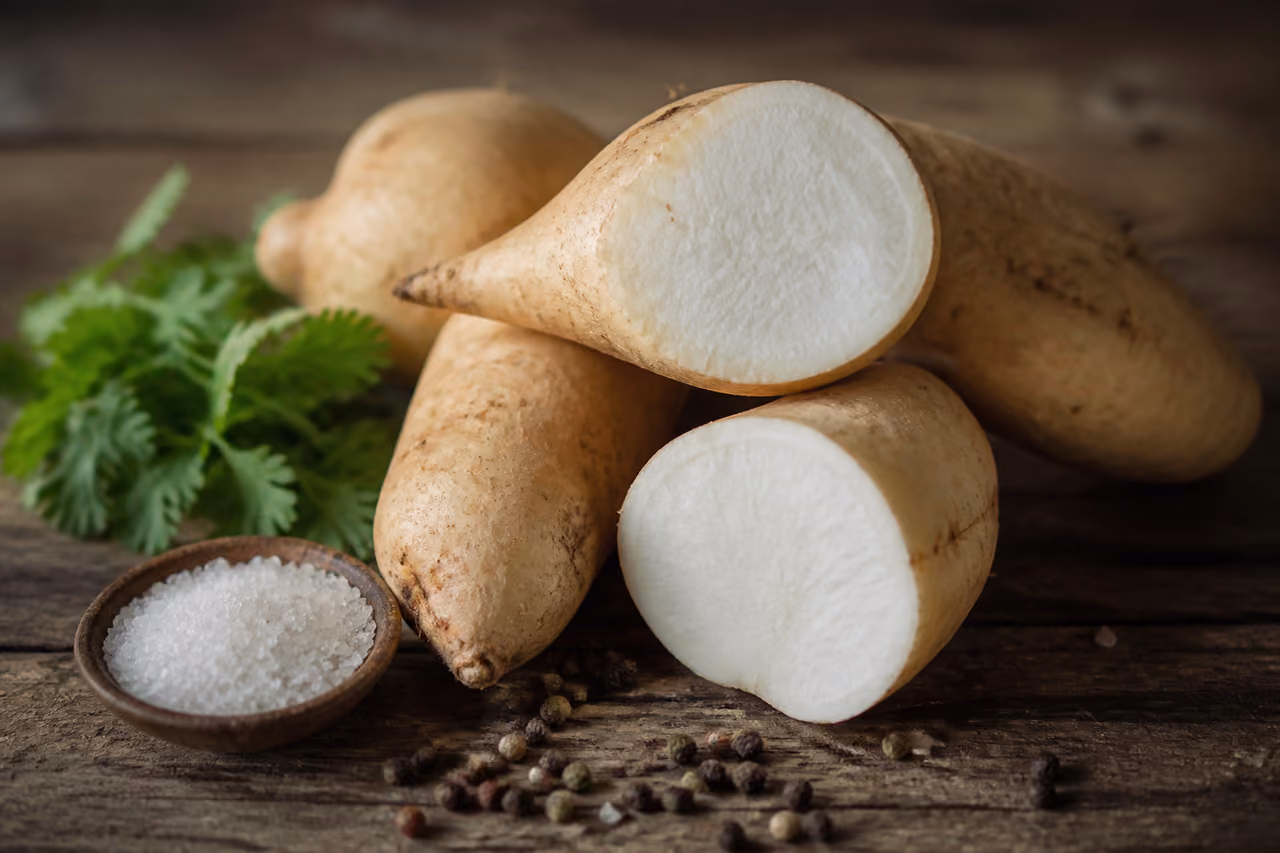Raw Indian Sweet Potato Tubers on a Rustic Wooden Table