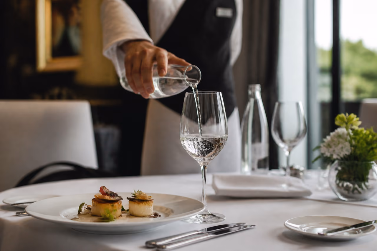 Professional Server Setting a Fine Dining Table