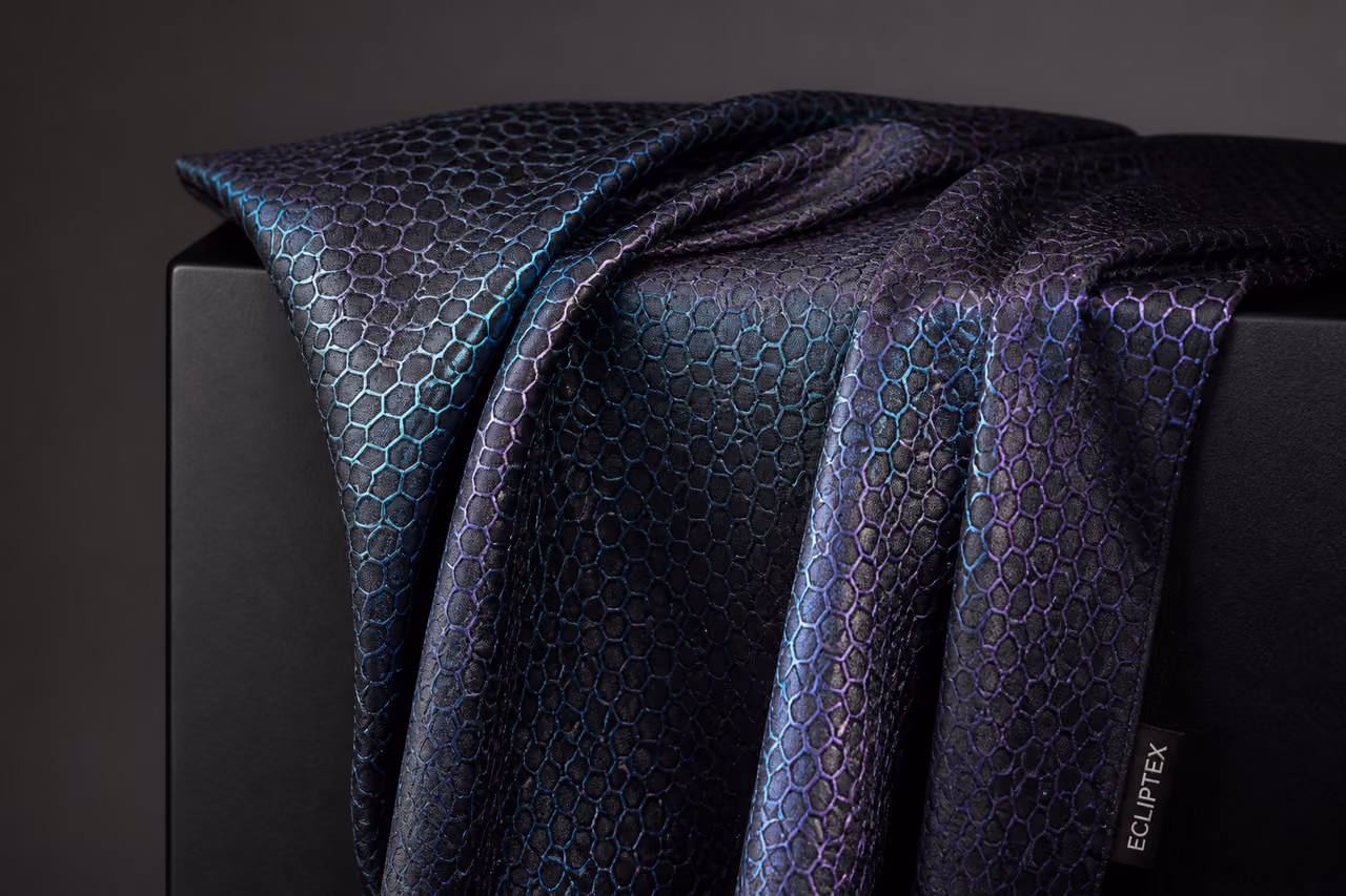 Iridescent Ecliptex Fabric Draped Over Minimalist Pedestal