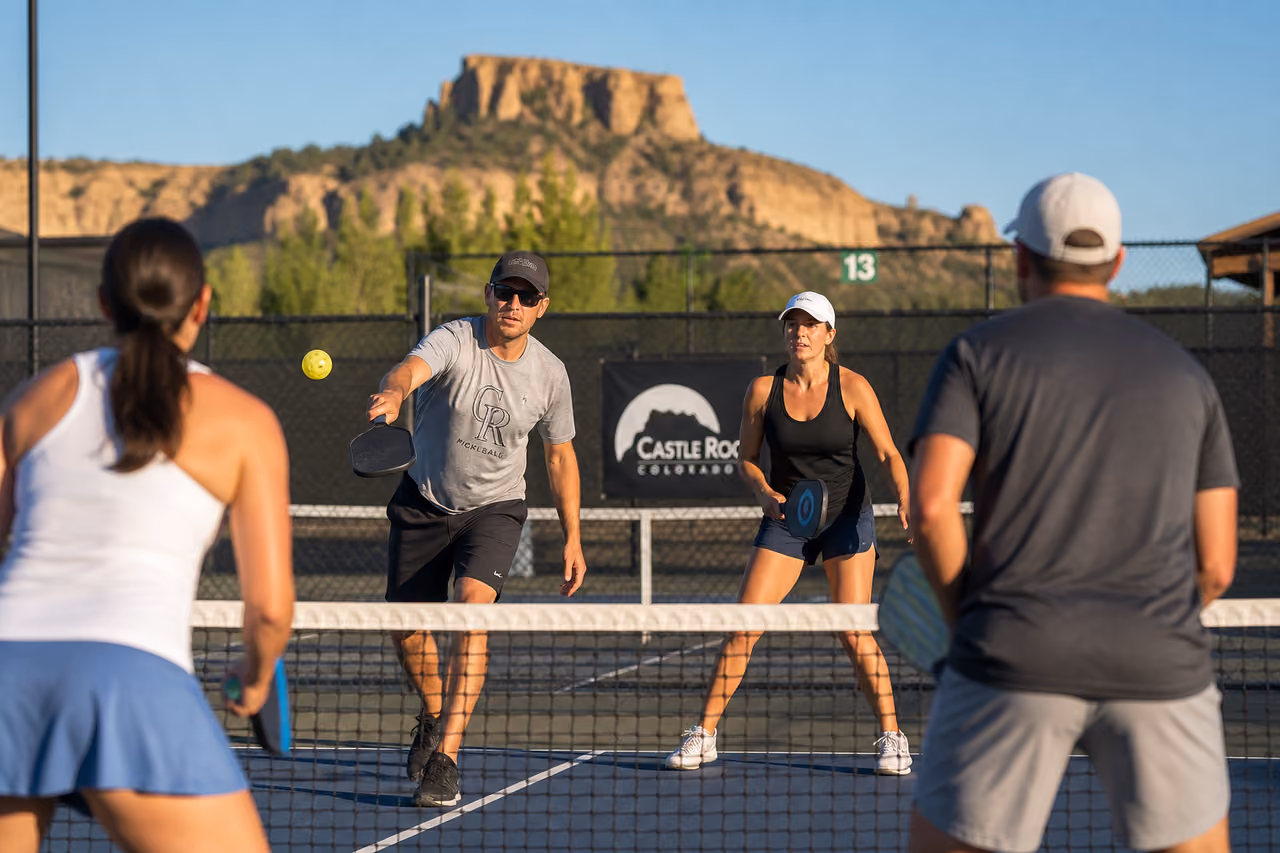 People Playing Pickleball with Red Rock Background in Castle Rock