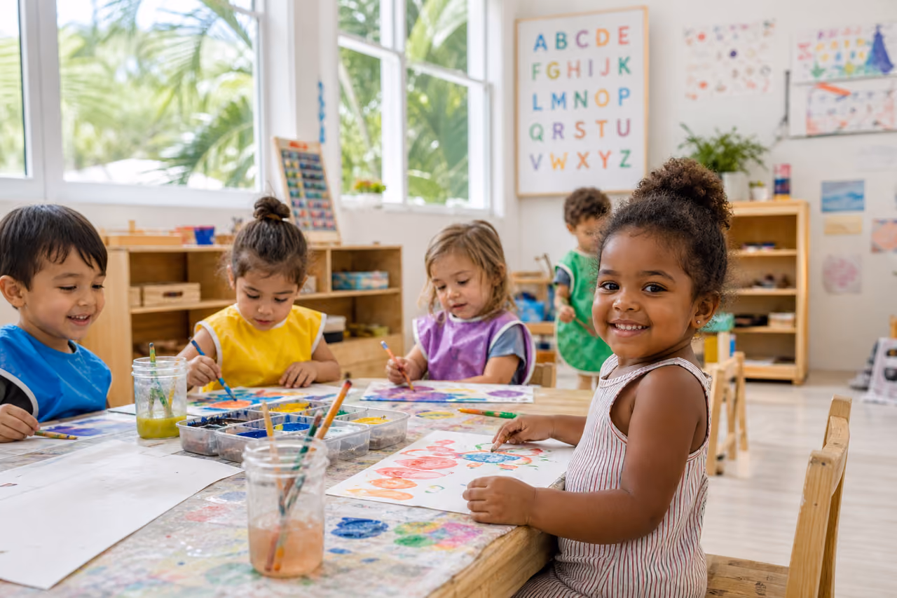 Diverse Children Painting in a Bright Miami Preschool Classroom