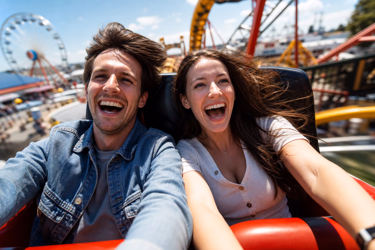 Couple Laughing While Riding a Fast Rollercoaster