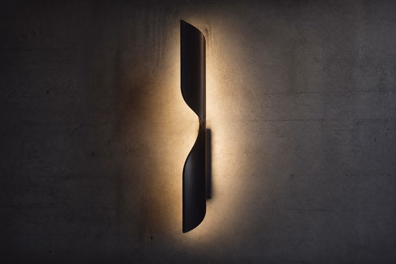 Modern Lamp Creating a Soft Light Back Glow on Concrete Wall