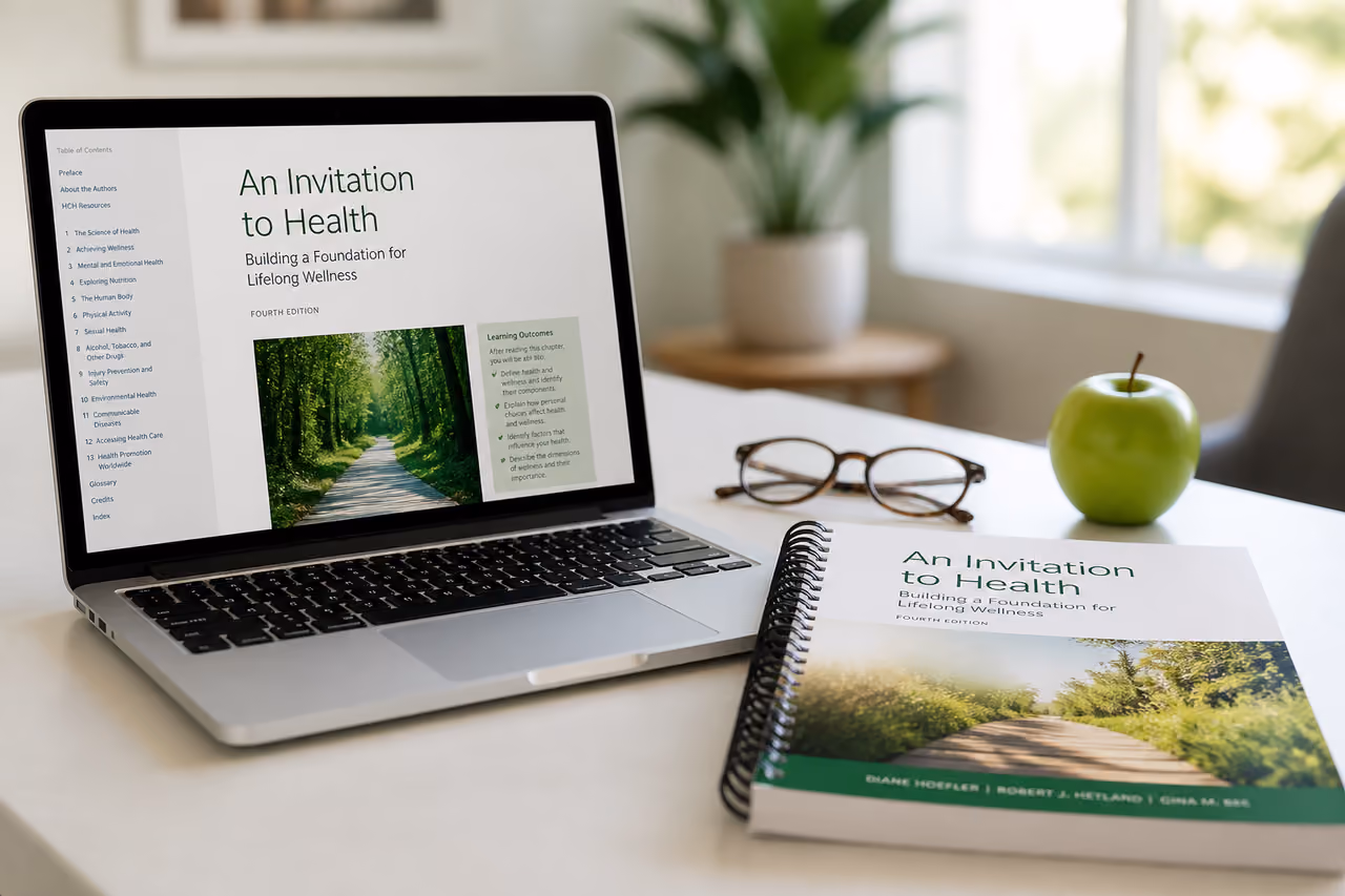 Digital and Printed Health Textbook on a Modern Desk