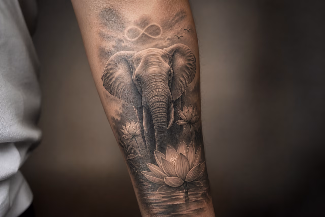 Detailed Elephant Memorial Tattoo on a Person's Forearm