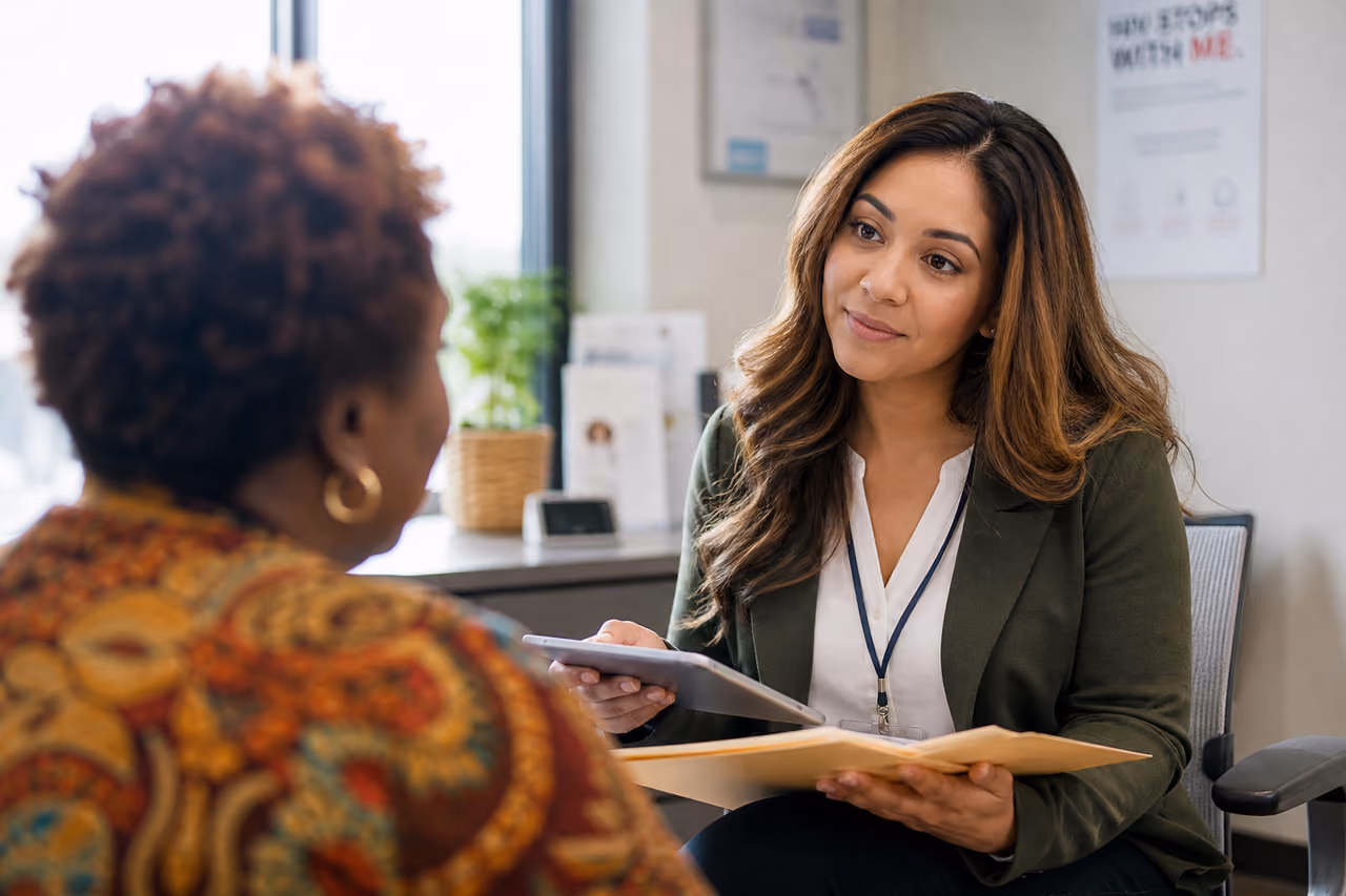 Case Manager Consulting with Patient in Health Clinic