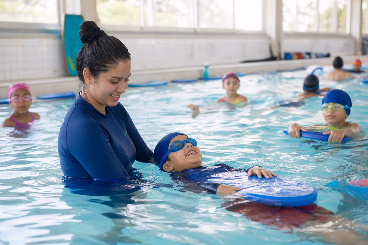 Children Taking Swimming Lessons at a Community Pool