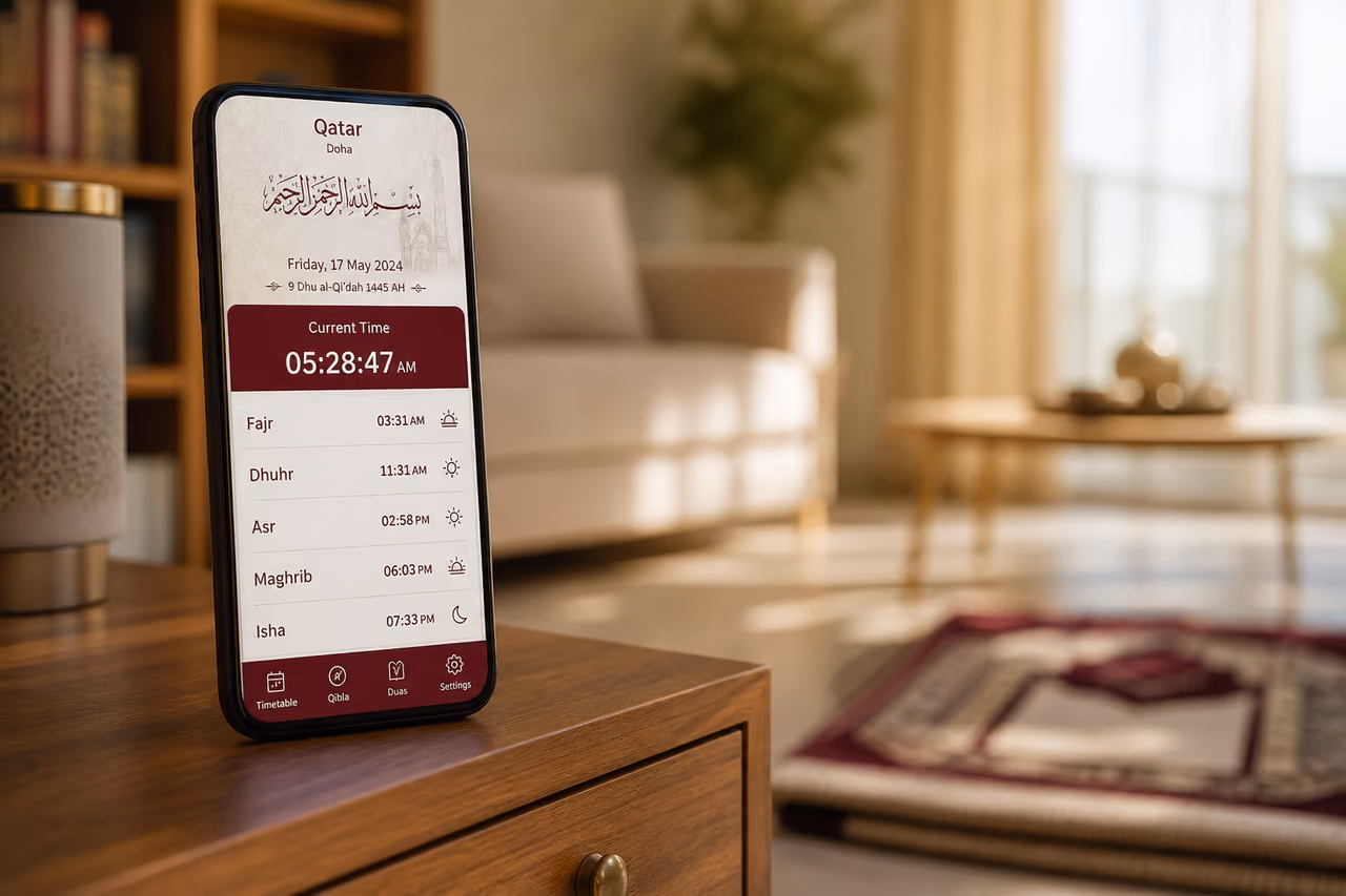 Smartphone Displaying Qatar Prayer Time Table on Bedside Table