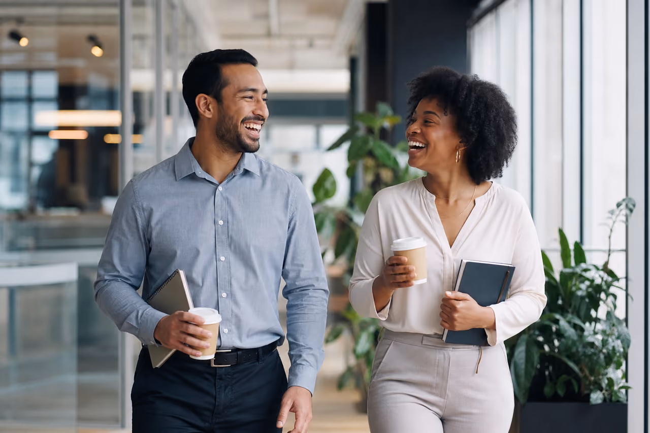 Diverse Colleagues Walking and Talking in a Modern Office