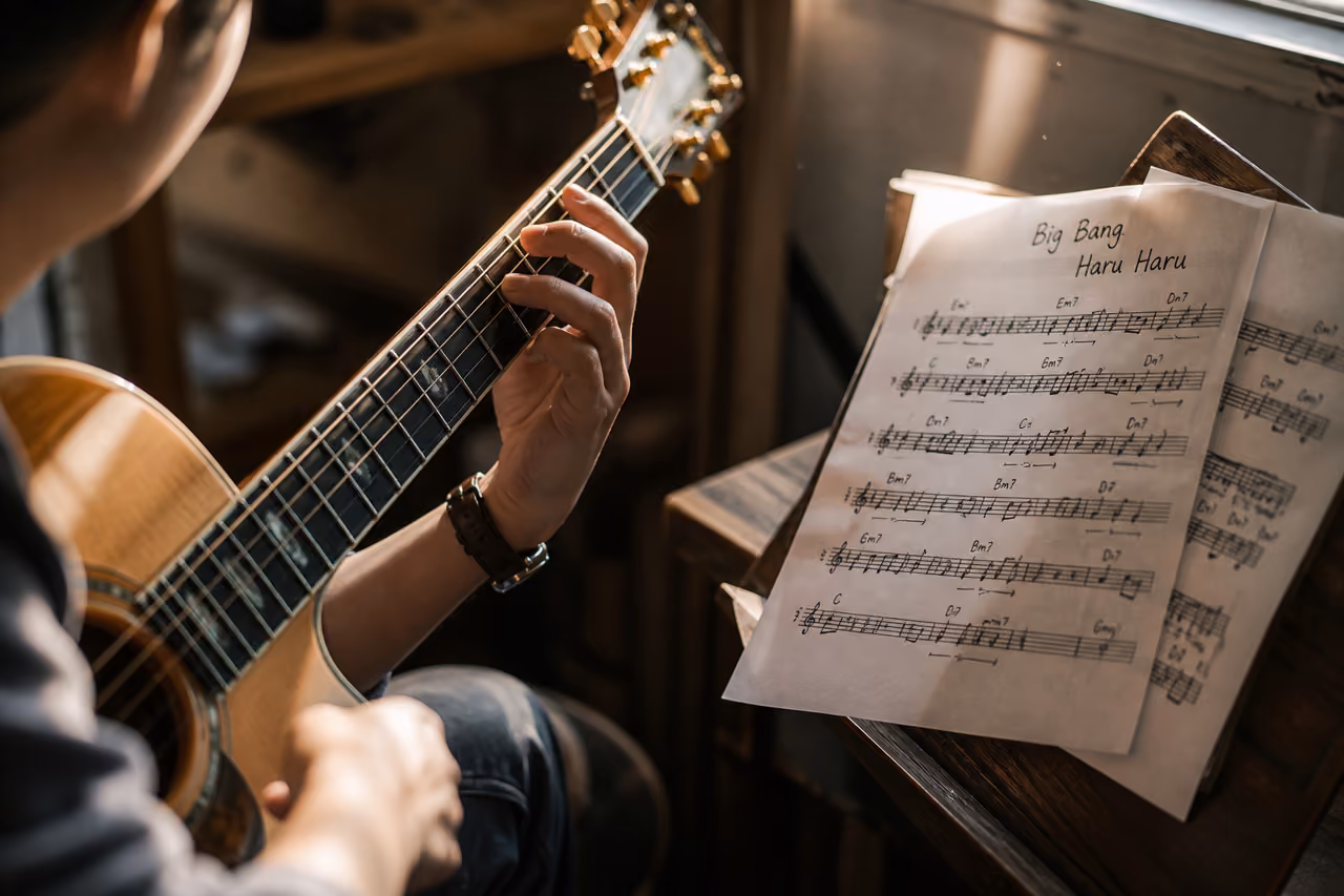 Musician Playing Big Bang Haru Haru Chords on Acoustic Guitar