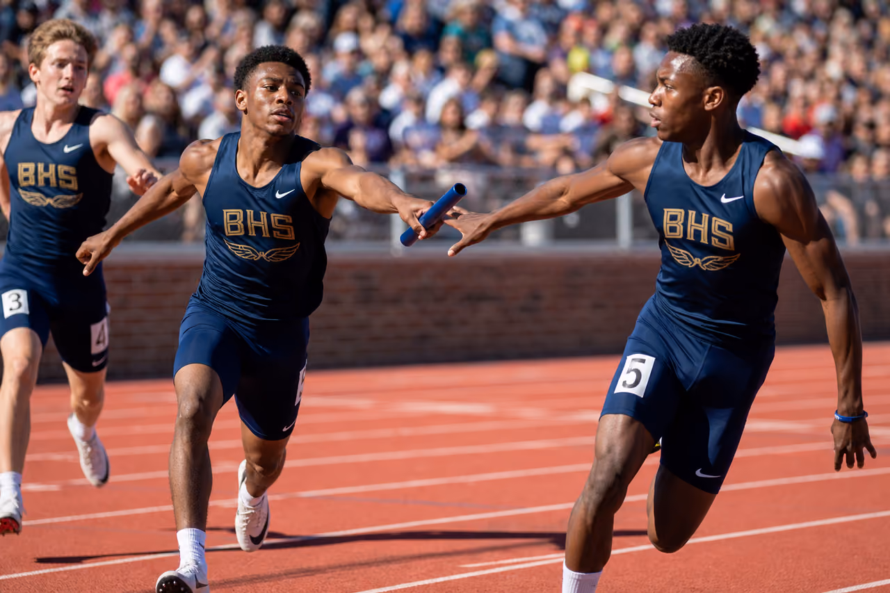 High School Athletes Exchanging Baton During Track and Field Relay