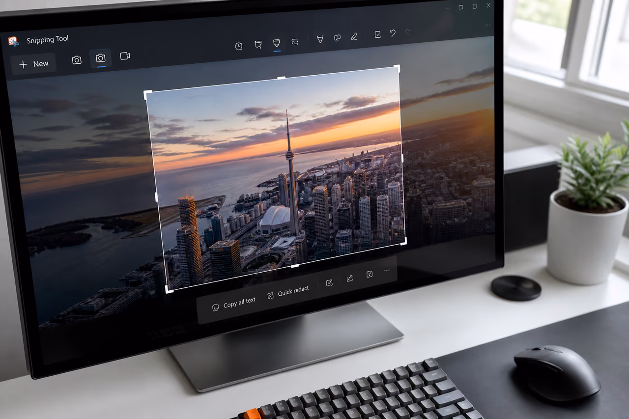 User Cropping an Image Using a Snipping Tool on Monitor