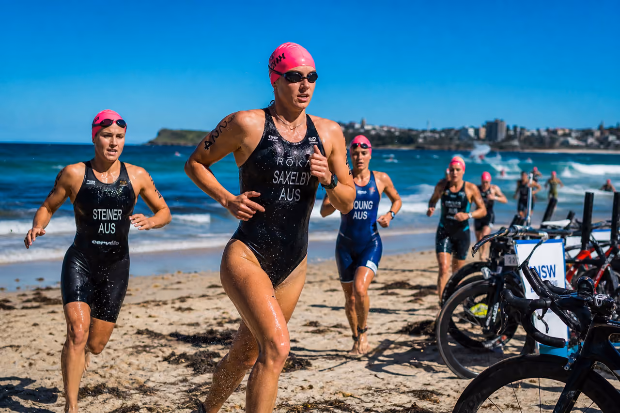 Triathletes Transitioning from Swim to Bike at Nsw Triathlon