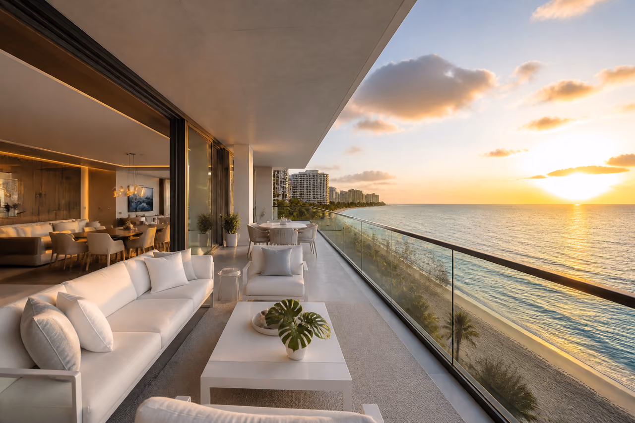 Luxury Beachfront Balcony Overlooking Turquoise Ocean at Sunset