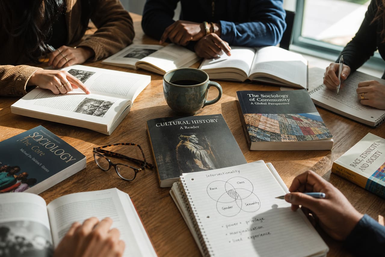 Diverse Students Studying Intro to Ethnic Studies Materials