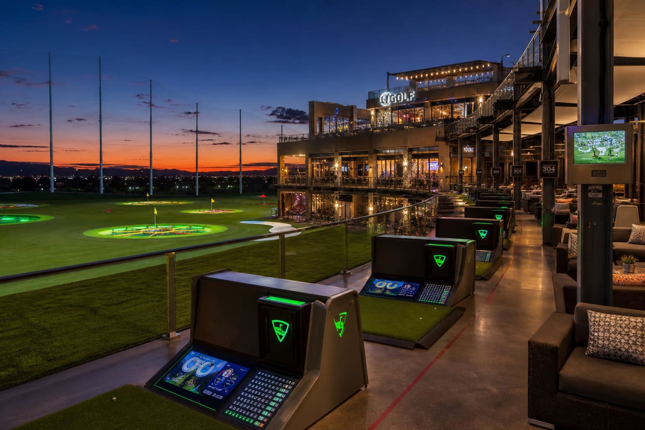 Illuminated Hitting Bays at a Luxury Golf Entertainment Venue