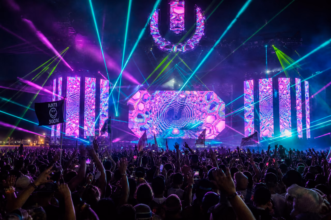 Crowd Dancing at Electronic Music Festival with Laser Lights