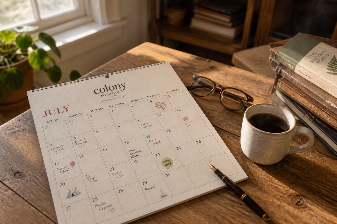 Printed Colony Woodstock Calendar on a Rustic Wooden Desk