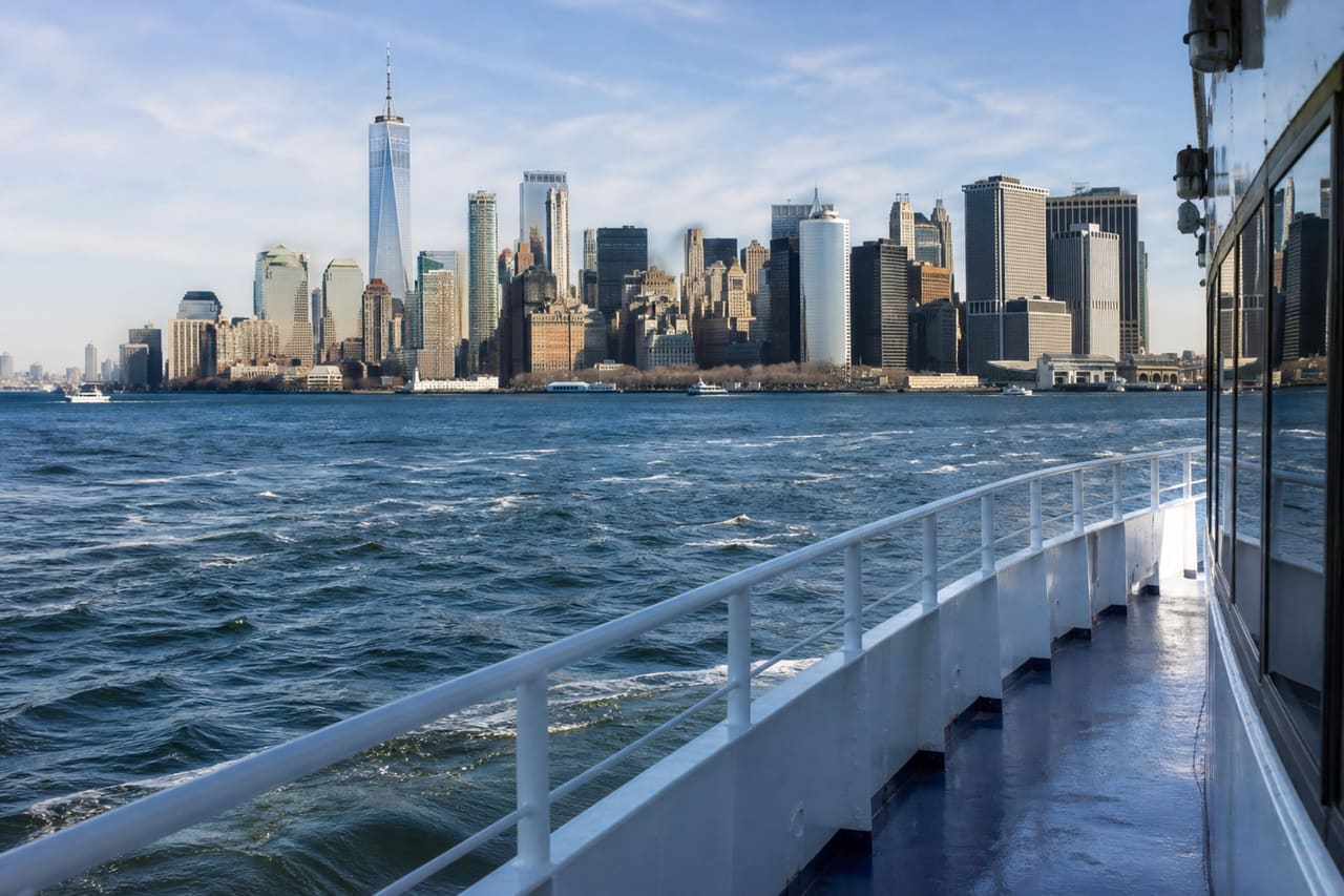 Passenger Ferry Traveling Toward Governors Island with Manhattan Skyline