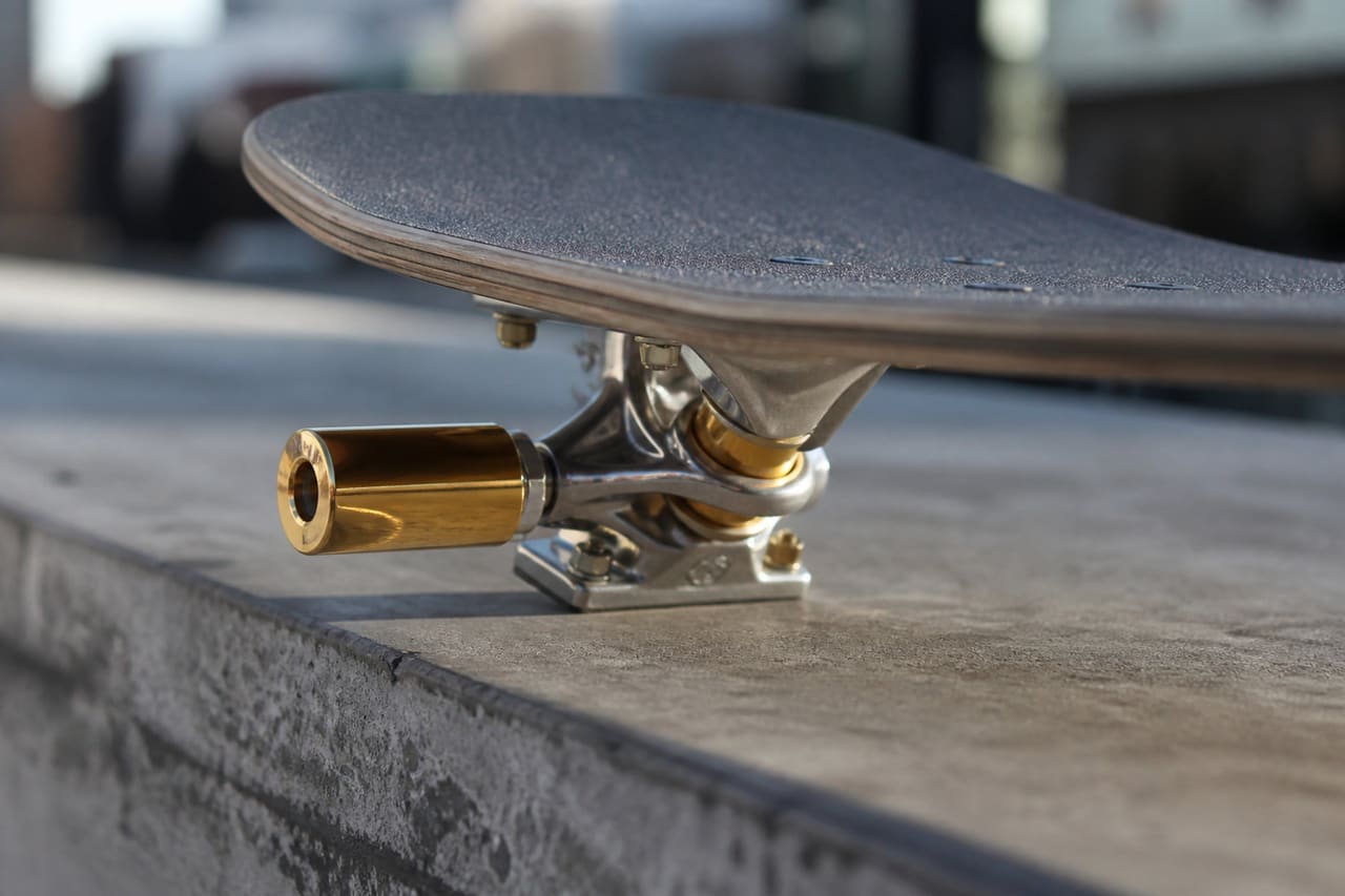 Polished Cult Butter Pegs Mounted on Skateboard Truck