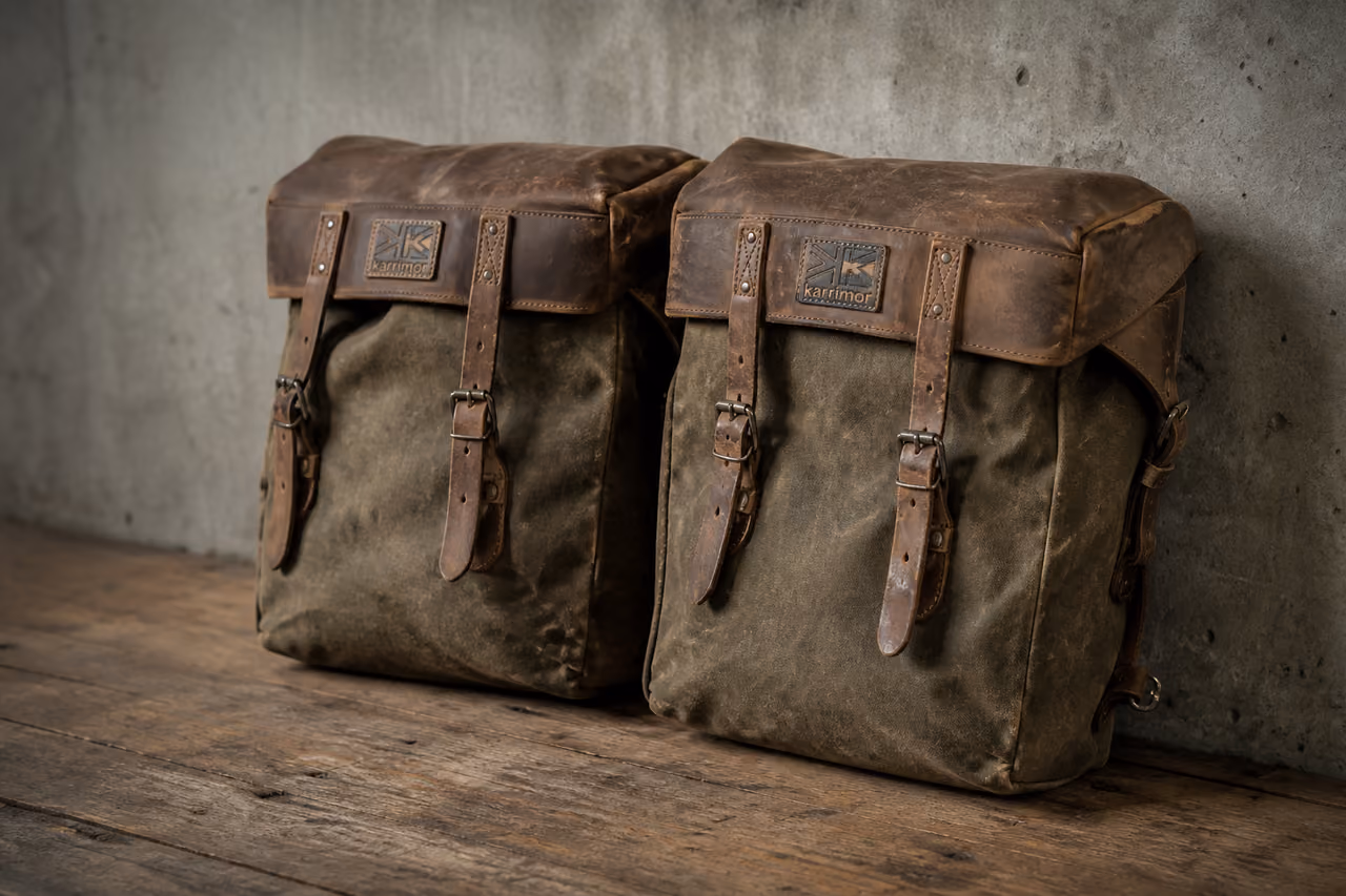 Pair of Vintage Karrimor Panniers on Rustic Wooden Floor