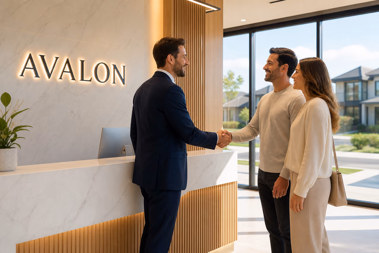 Real Estate Agent Greeting Clients in a Modern Office