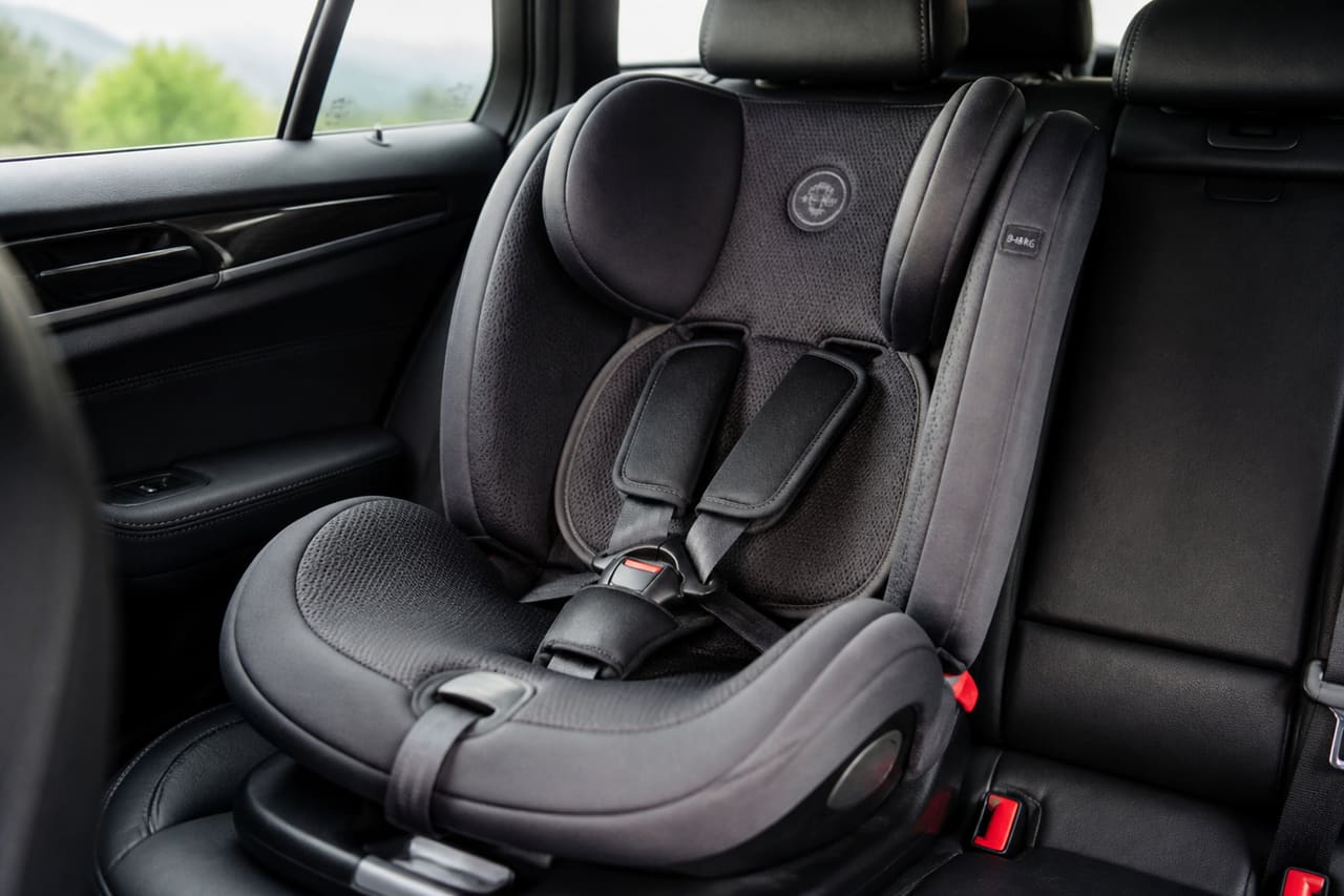Modern Baby Car Seat Installed in Vehicle Rear Seat